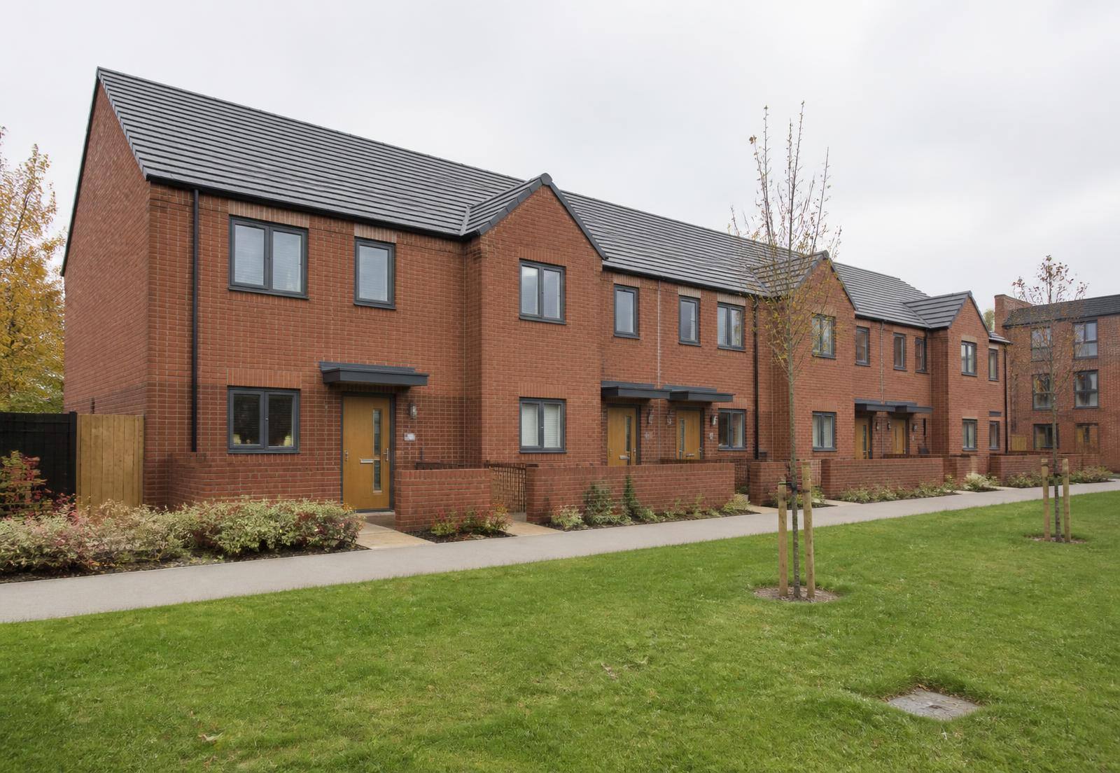 Modern brick housing terrace with landscaped frontage