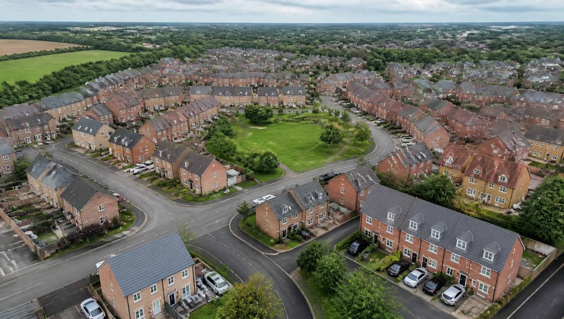 Aerial view of a completed housing neighbourhood with green space